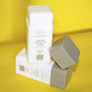 photo of two sweet pitti deodorant cream bottles against a yellow background