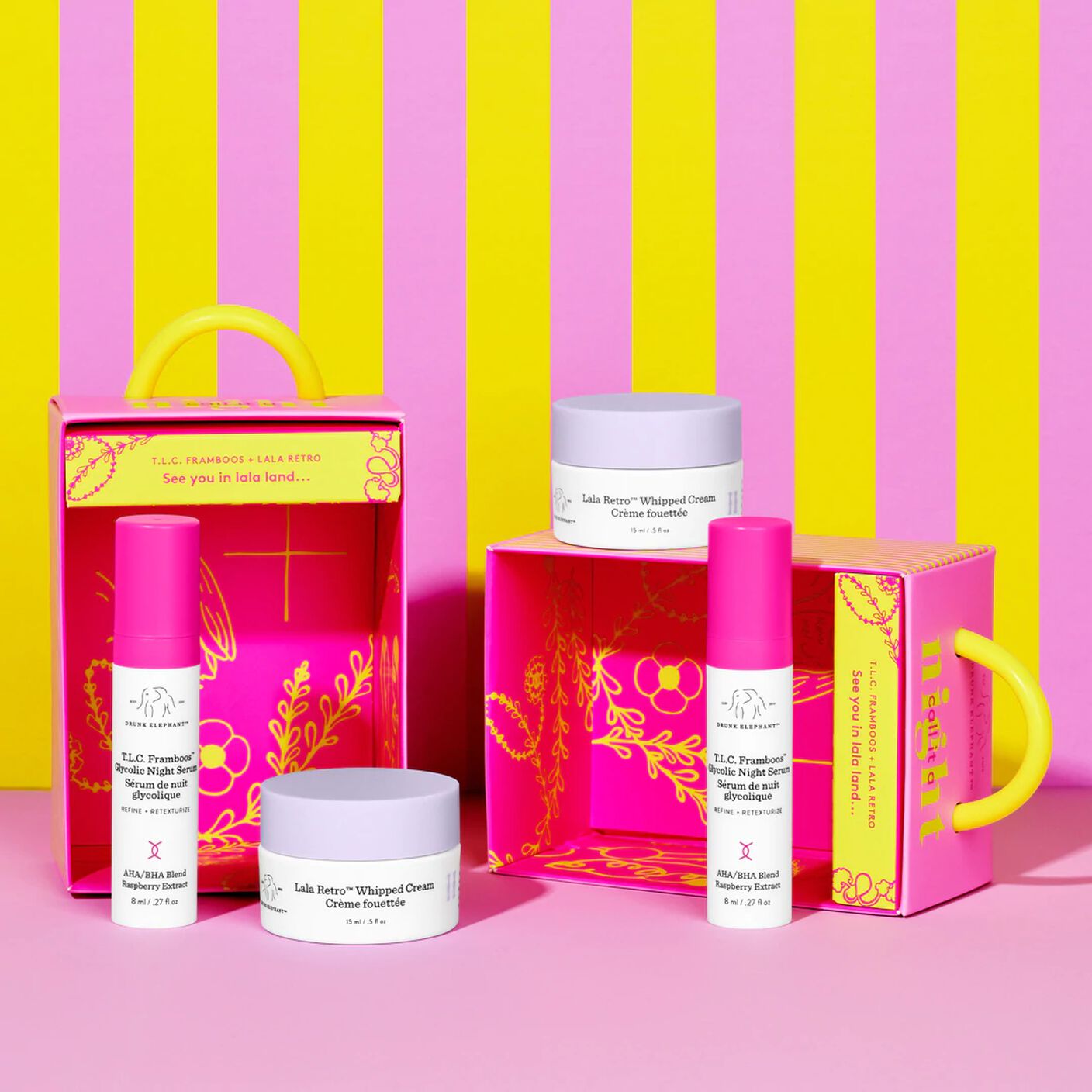 Two Call it a Night Duos on a pink table in front of a pink and yellow striped wall. 