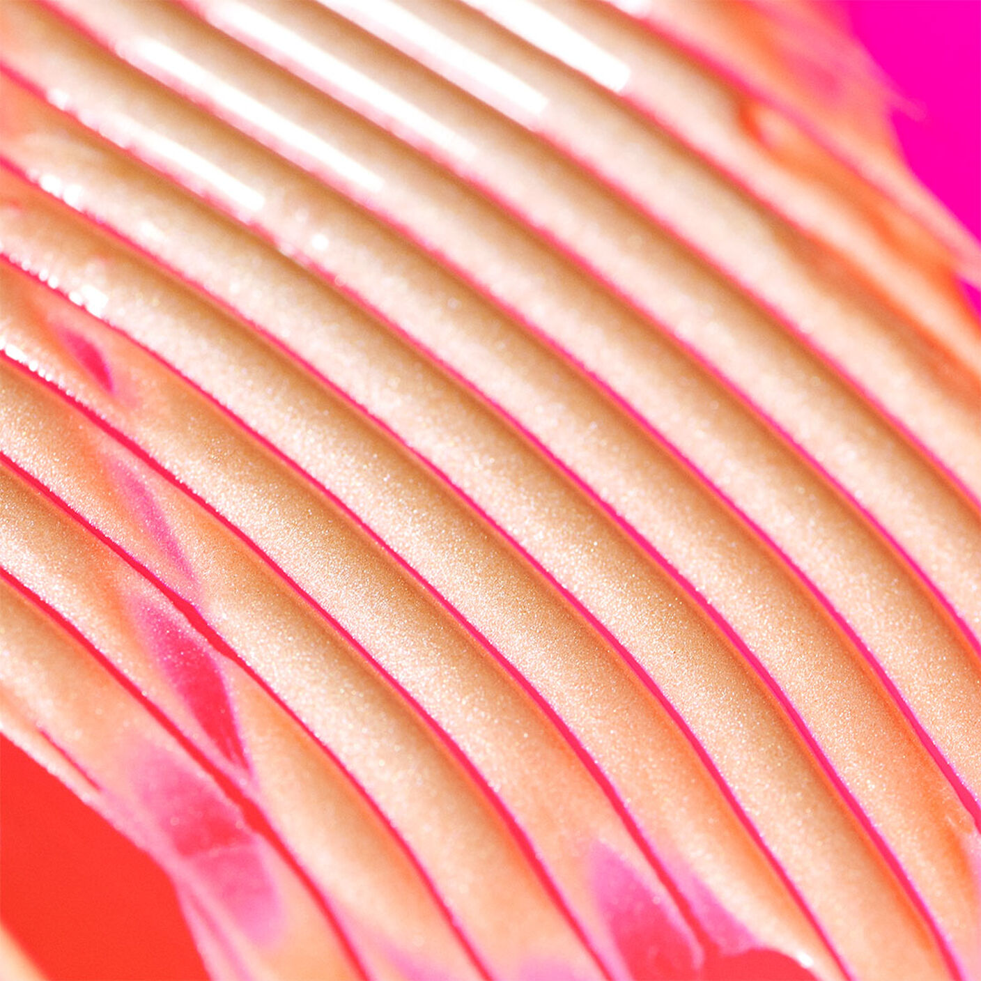 B-Goldi serum on a pink table lined across styized. 