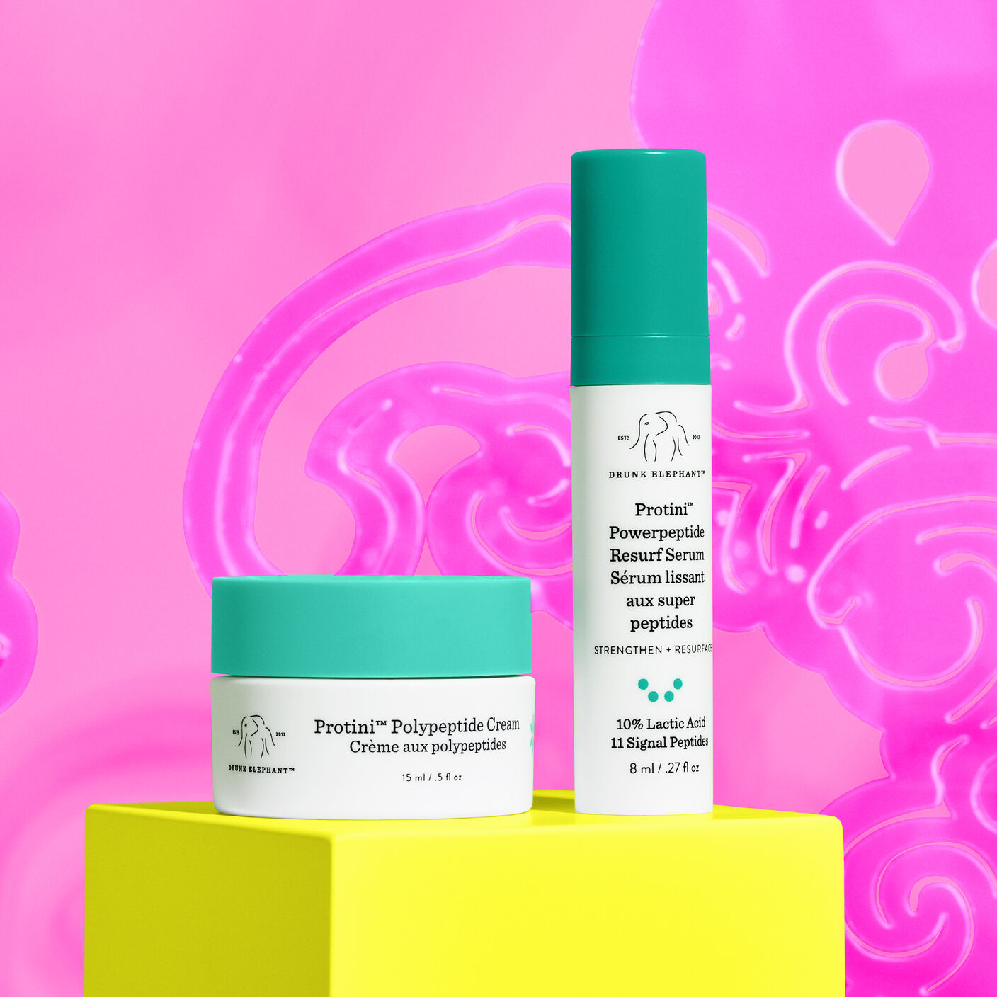 Protini Serum and Protini Cream against a pink background