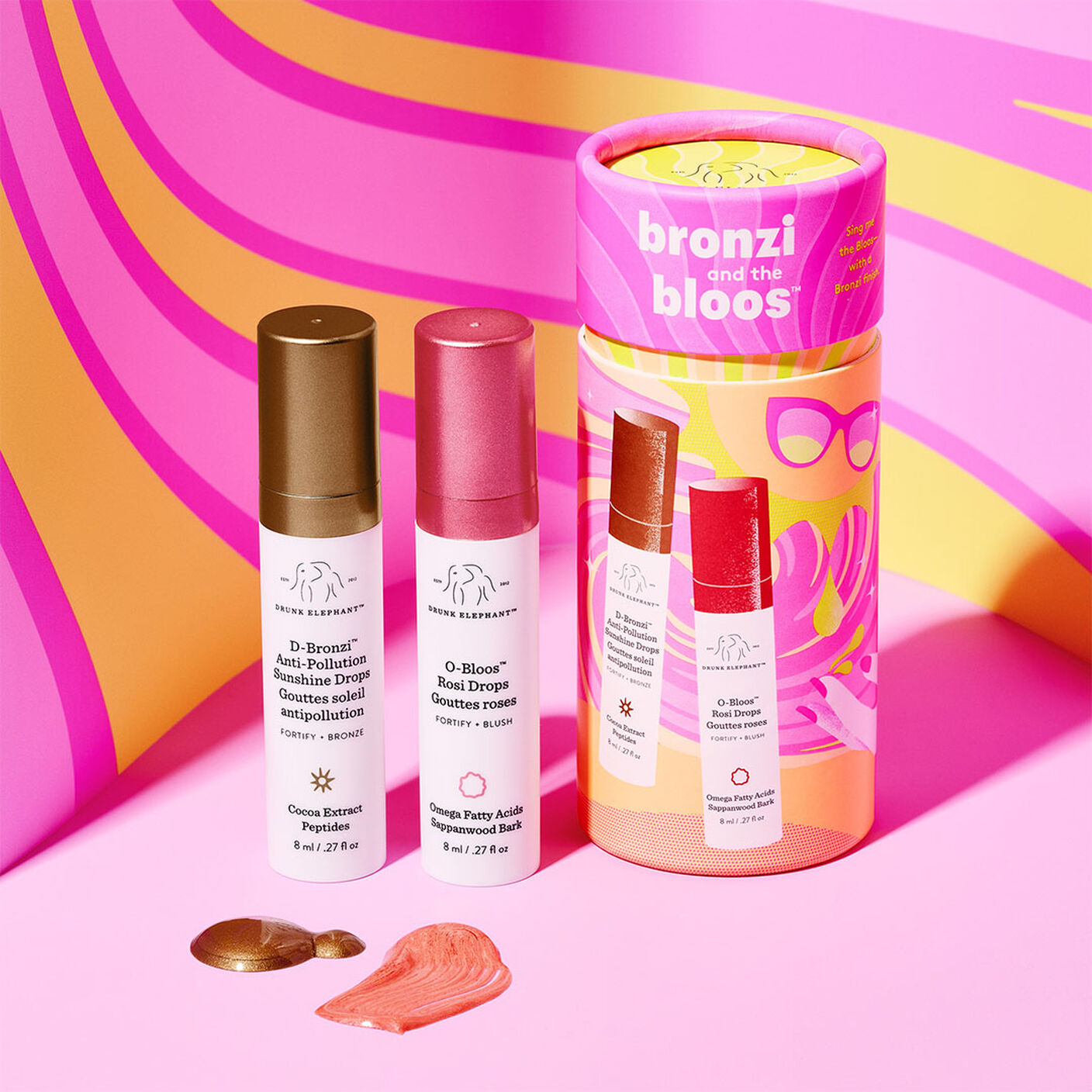  O-bloos and D-bronzi with texture smears and cylindrical packaging on a pink background. 