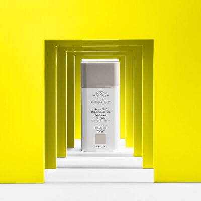 Sweet Pitti™ Deodorant Cream against a yellow stylized background