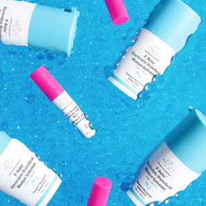 photo of F-Balm bottles and mini TLC Framboos "floating" in blue moisture beads