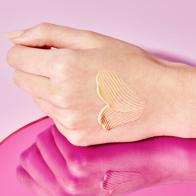 T.L.C. Sukari Babyfacial™ product texture on the back of a hand