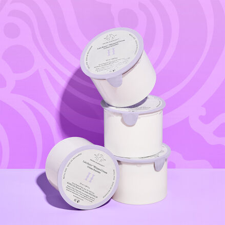 Three Lala refill pods stacked next to one lying on its side