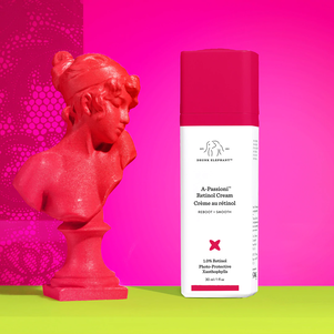 photograph of Drunk Elephant A-Passioni retinol next to a statue