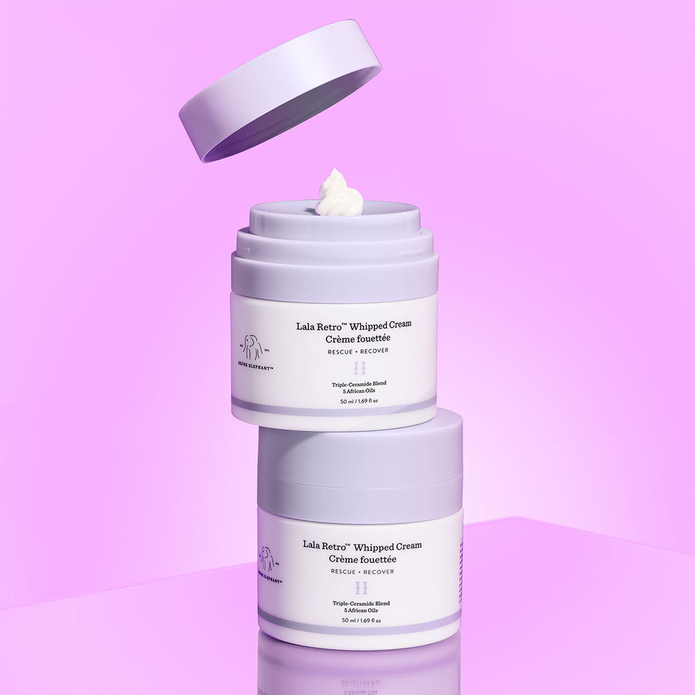 Lala Retro cream container on top of eachother with a pump of cream on top. 