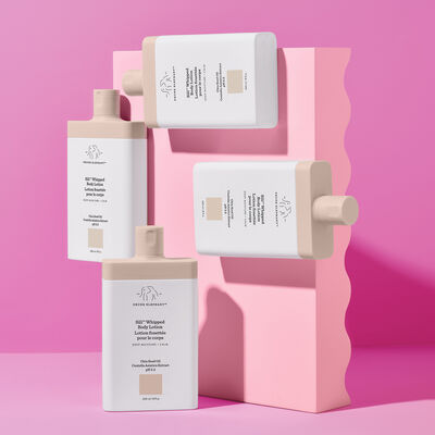 Multiple Sili™ Whipped Body Lotions arranged against a pink background