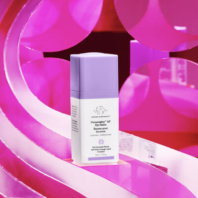 Ceramighty™ AF Eye Balm against a pink stylized background