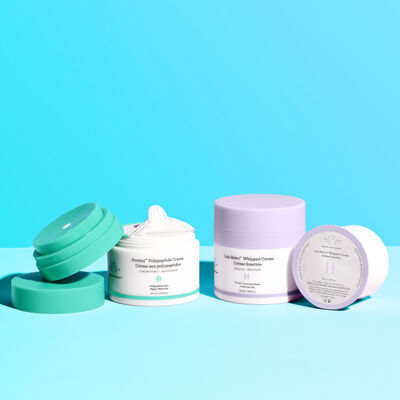Lala Retro refill pod and container next to Protini refilled container with a blue background